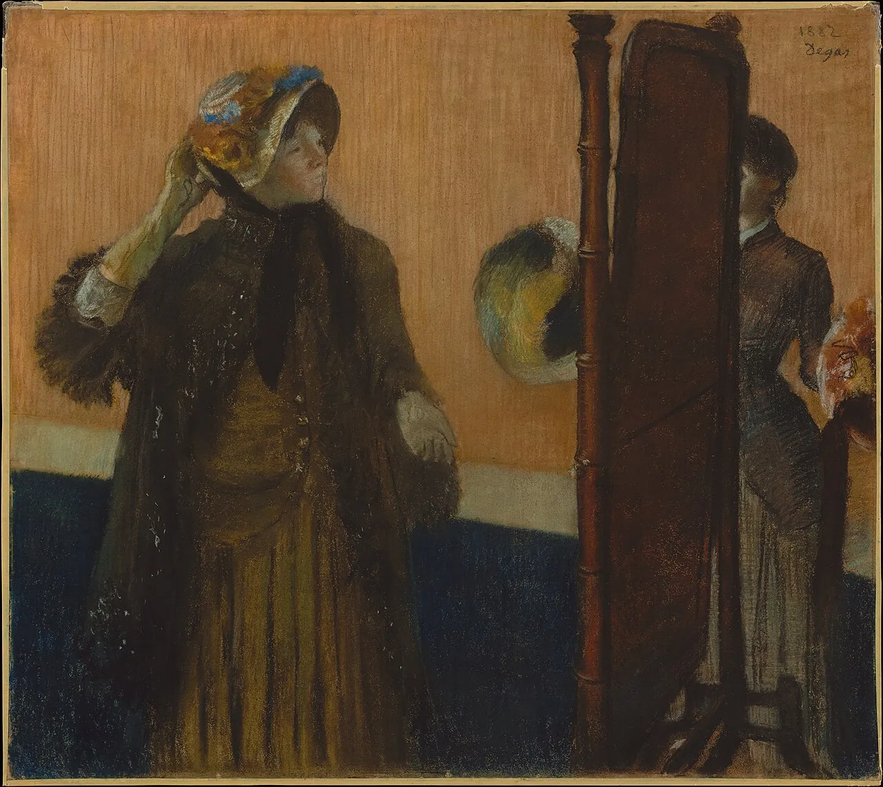 At the Milliner's by Edgar Degas